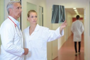 Medical staff looking at xray